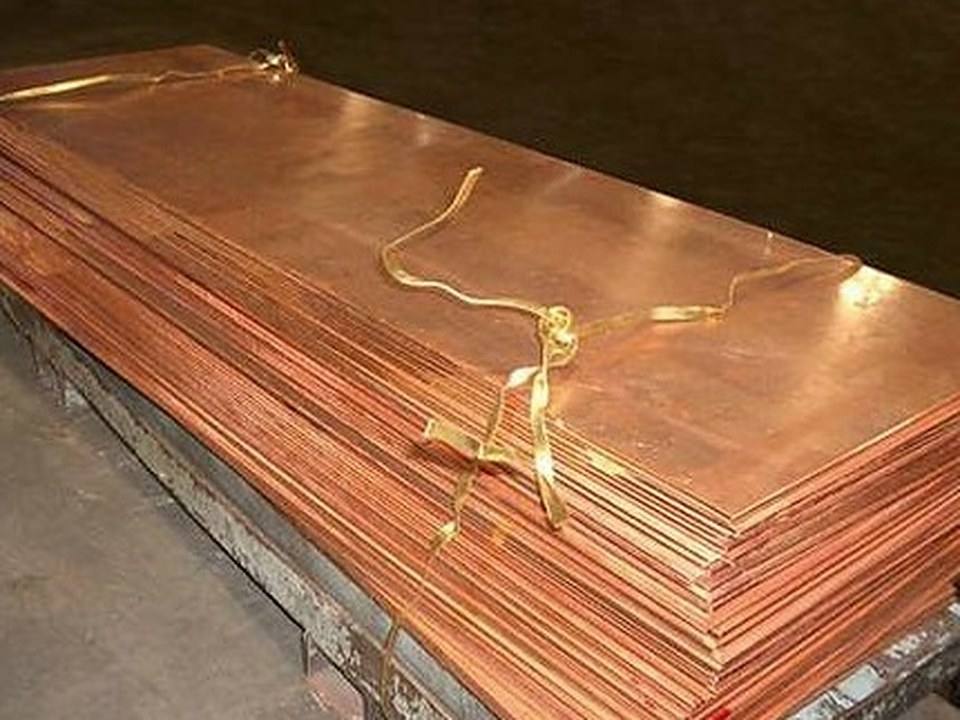 Copper sheets laid flat, their surfaces catching the light