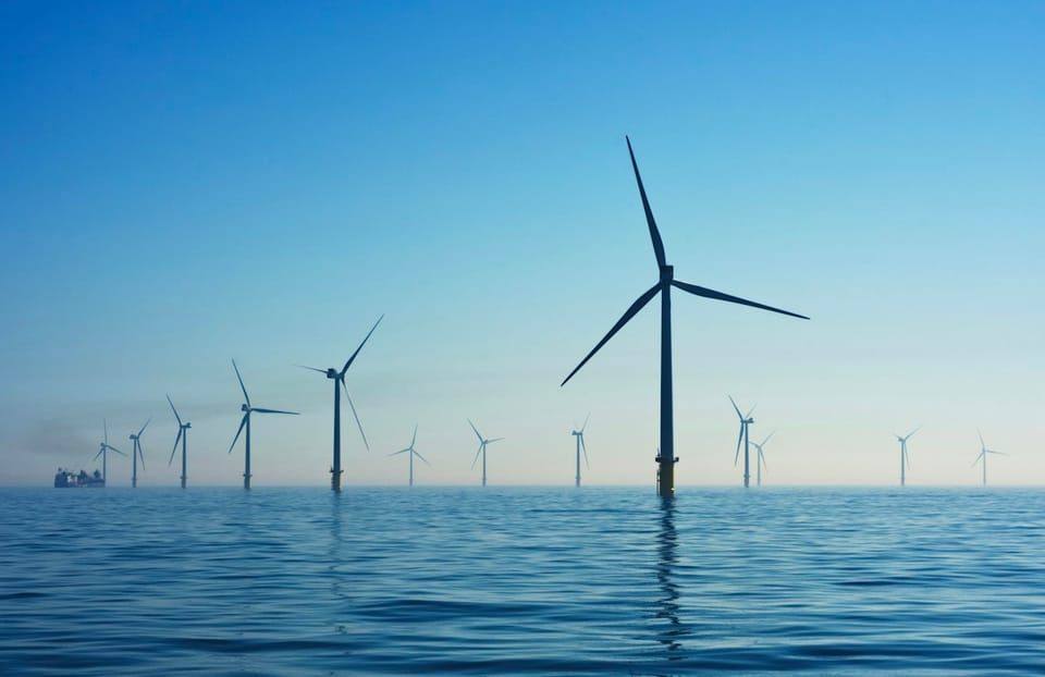 Offshore wind turbines under a clear sky